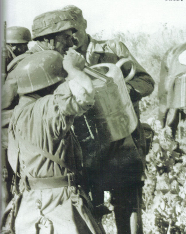 Fallschirmjager of the 3rd Fallschirmjager Regiment, drinking water. Kreta, 20. May. 1941.