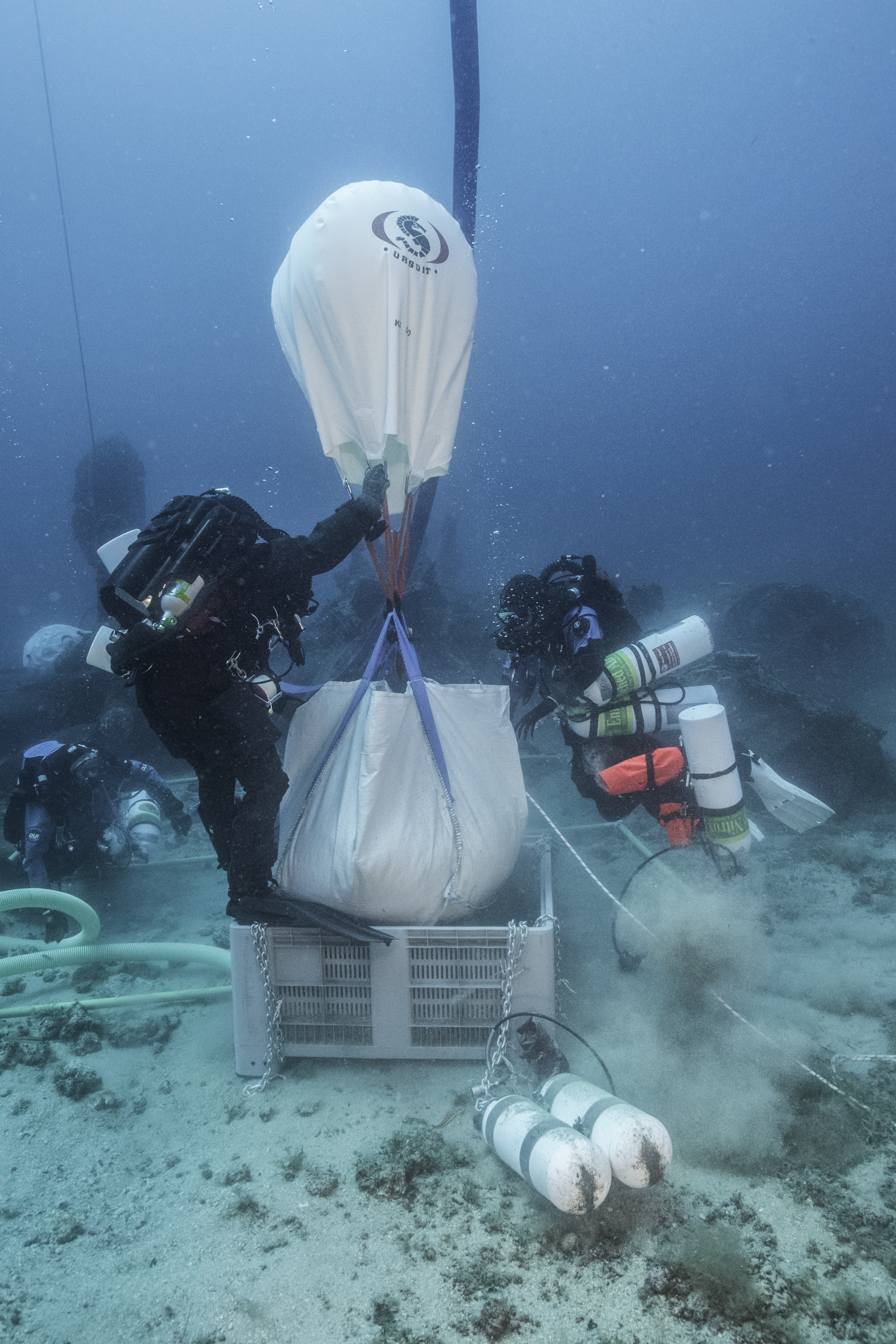 Items recovered from the B-24J "Tulsamerican" off the island of Vis in Croatia are gently lifted to the surface. Photo by Brett Seymour