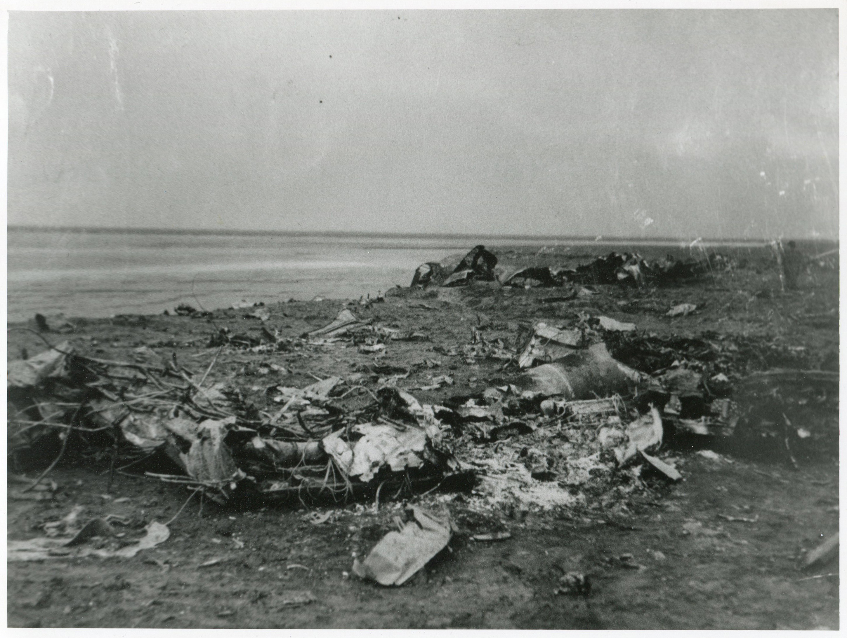burnt out wreckage of the Ju88 scattered across banks Marsh. (Photo: Russell Brown Collection)