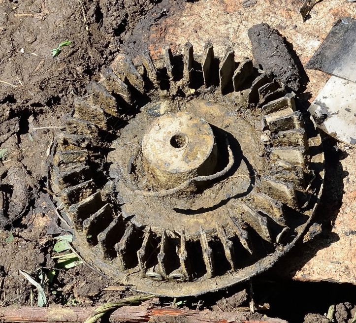 Vickers K magazine, partly used and obviously been in a fire, as shown by the remaining cartridges which have all exploded.